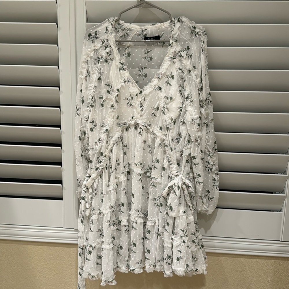 White floral dress. Ties on both sides. White slip under dress.